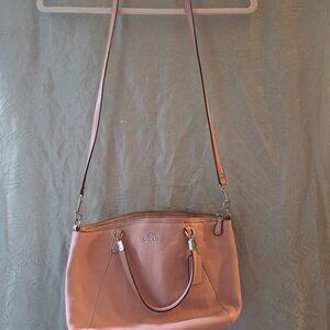 Light pink coach purse with strap